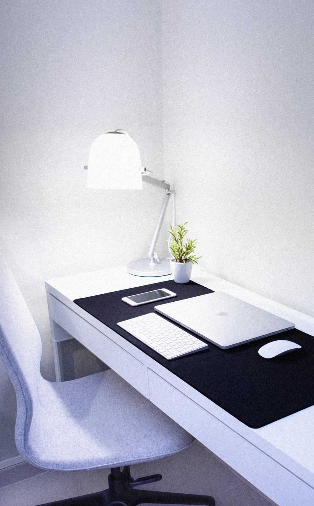 photo-of-macbook-pro-near-iphone-and-apple-magic-keyboard-2528116